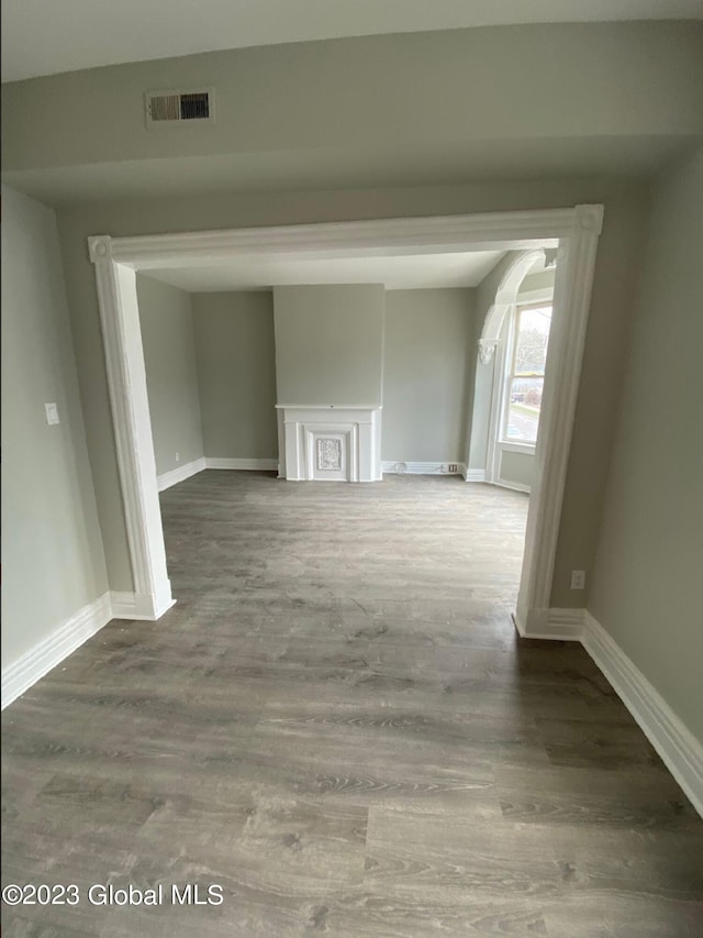 hallway with dark wood-type flooring