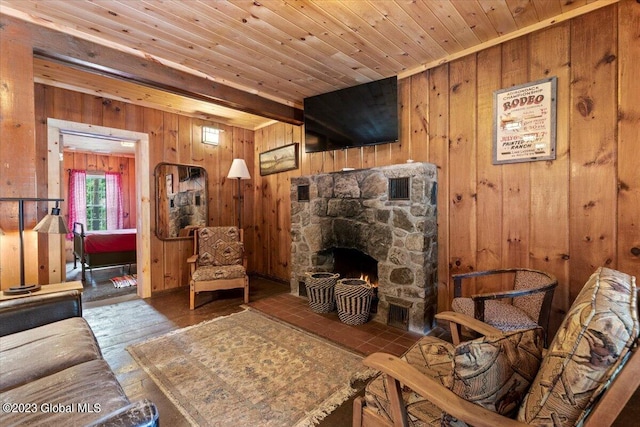 living room with a fireplace, dark wood-type flooring, wood ceiling, and wooden walls