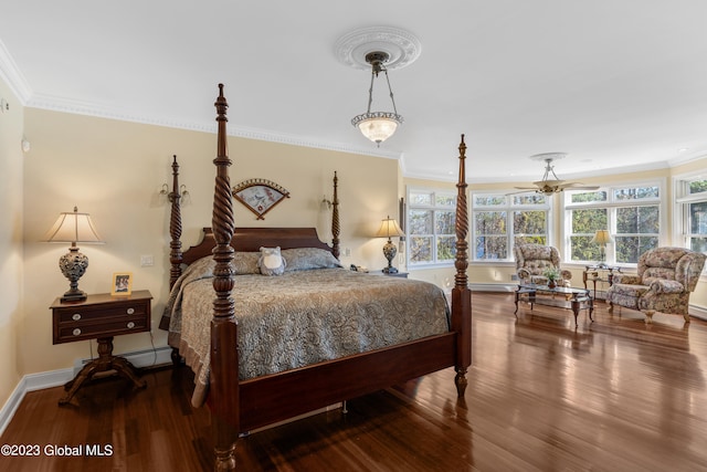 bedroom featuring ornamental molding, hardwood / wood-style floors, and a baseboard radiator