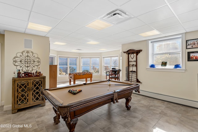 recreation room with billiards, a drop ceiling, light tile floors, and a baseboard heating unit