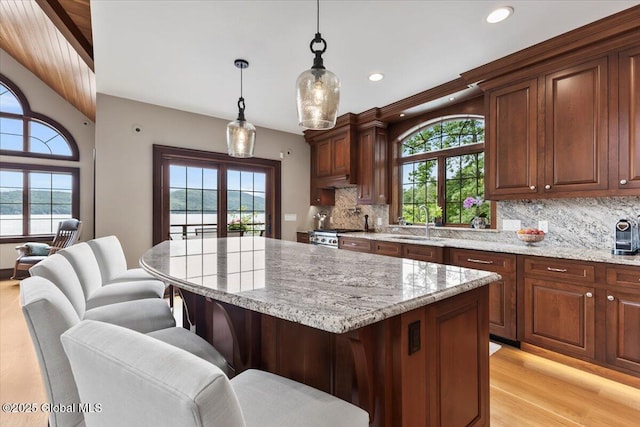 41 Trinity Rock Rd, Lake George, NY 12845 - kitchen with plenty of natural light, decorative backsplash, a kitchen bar, and recessed lighting