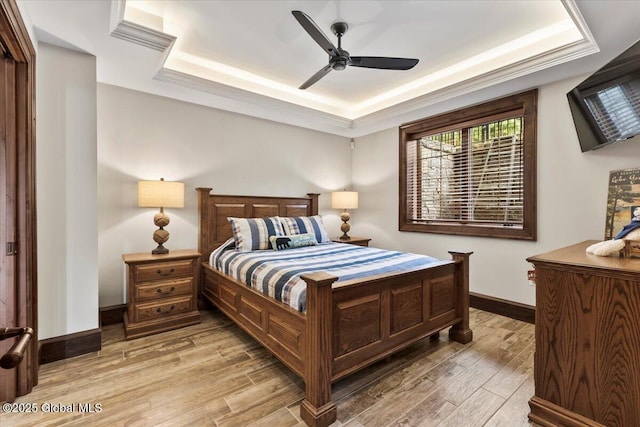41 Trinity Rock Rd, Lake George, NY 12845 - bedroom featuring a tray ceiling, light wood-type flooring, and ceiling fan