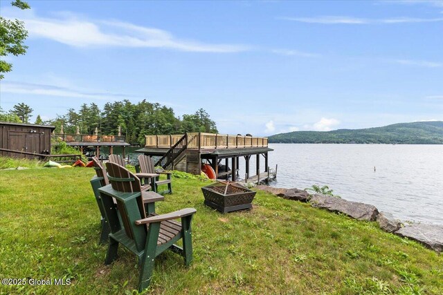 41 Trinity Rock Rd, Lake George, NY 12845 - dock area featuring a lawn, an outdoor fire pit, and a water view