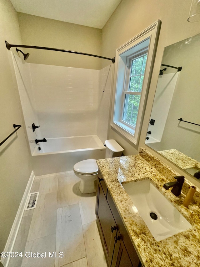 full bathroom with vanity, tub / shower combination, and toilet