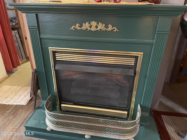 82 N Williams St, Whitehall, NY 12887 - room details featuring wood finished floors and a fireplace
