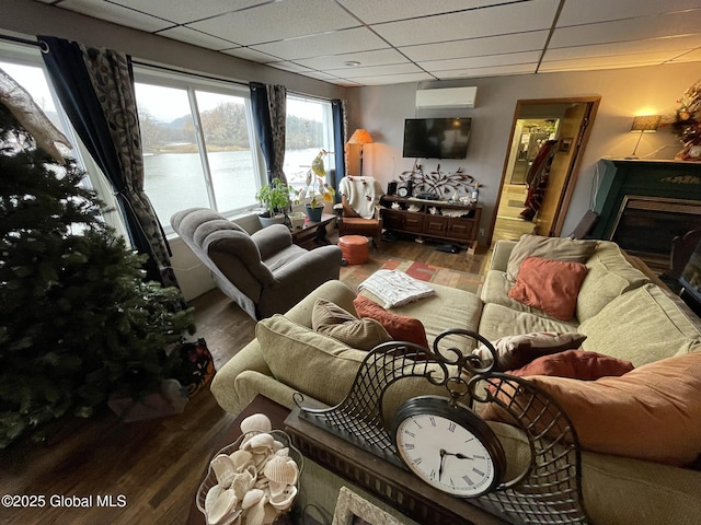 82 N Williams St, Whitehall, NY 12887 - living area featuring a fireplace, wood finished floors, and a paneled ceiling