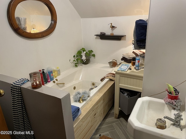 82 N Williams St, Whitehall, NY 12887 - bathroom with a whirlpool tub and a sink