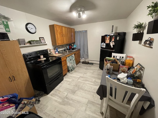 82 N Williams St, Whitehall, NY 12887 - kitchen featuring brown cabinetry, black appliances, and a baseboard radiator