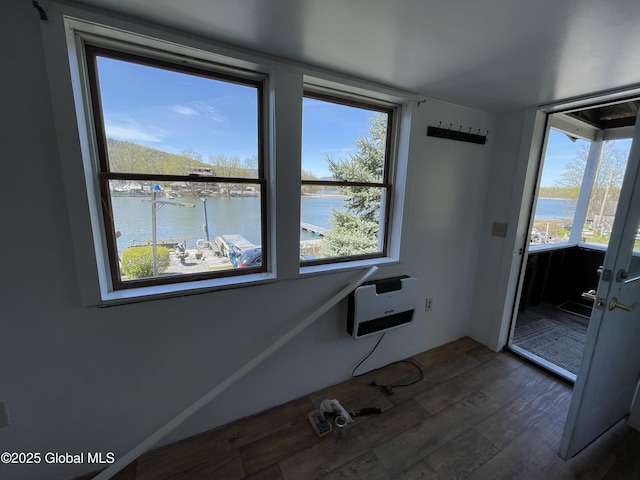 82 N Williams St, Whitehall, NY 12887 - interior space with heating unit, a water view, and dark wood-style floors