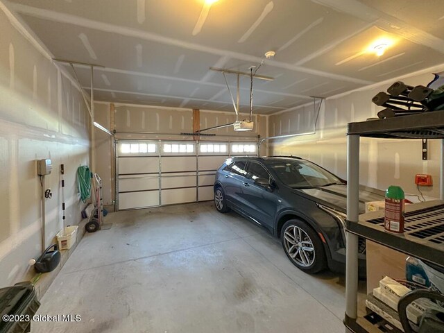 garage featuring a garage door opener