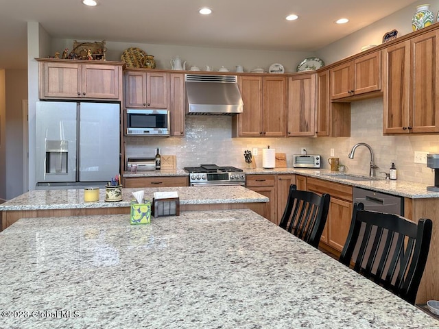 kitchen featuring tasteful backsplash, extractor fan, stainless steel appliances, a sink, and recessed lighting