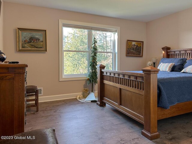 bedroom featuring dark hardwood / wood-style floors