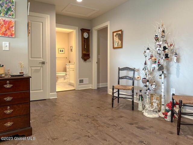 sitting room with dark hardwood / wood-style flooring