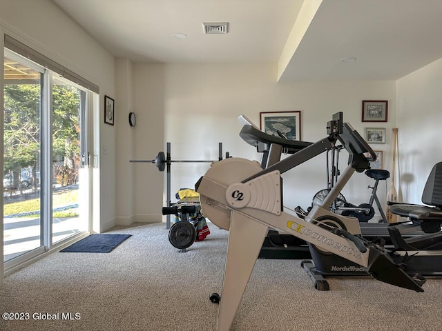 workout room with carpet floors and visible vents