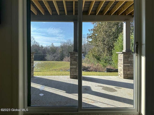 doorway to outside featuring a healthy amount of sunlight