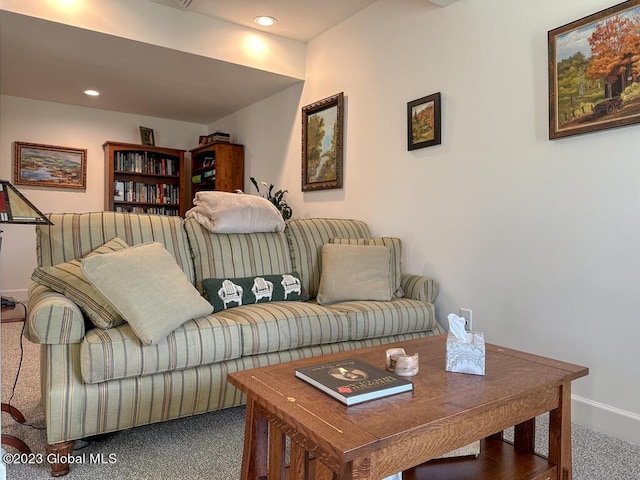 carpeted living area with recessed lighting, visible vents, and baseboards