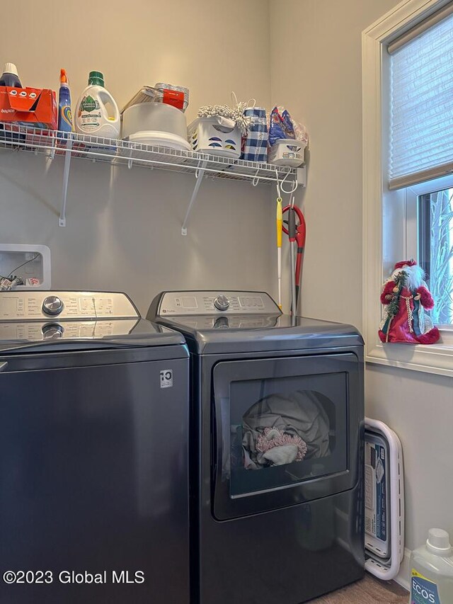 laundry room with washing machine and dryer