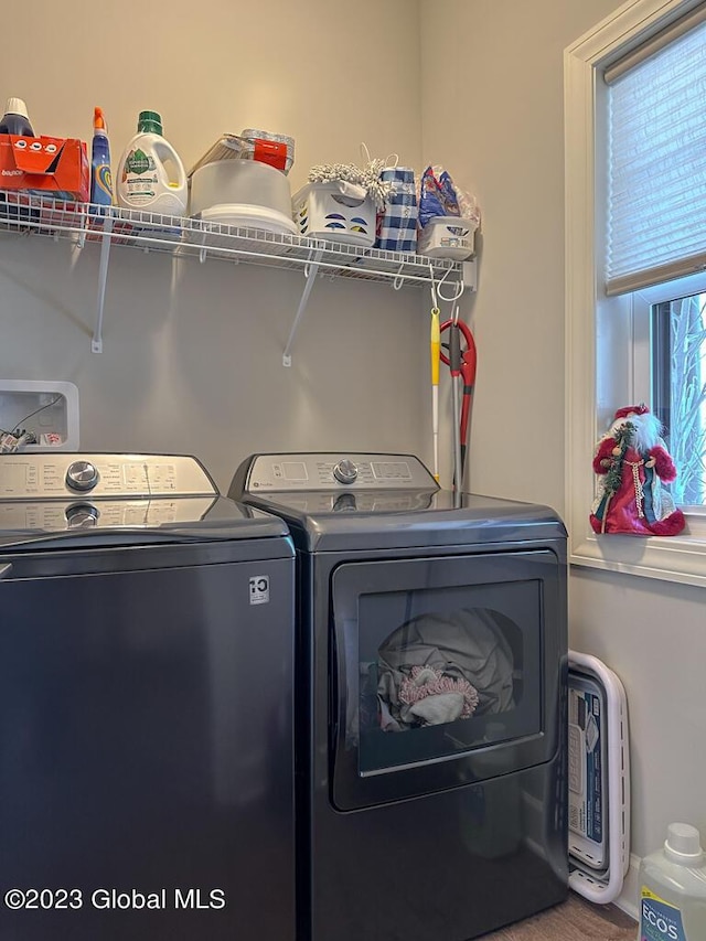 laundry area with laundry area and washer and clothes dryer