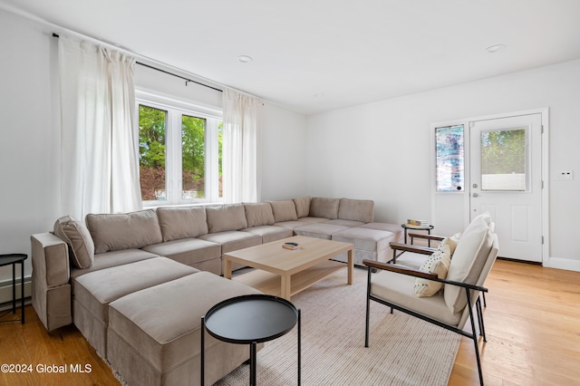 living room with light hardwood / wood-style flooring