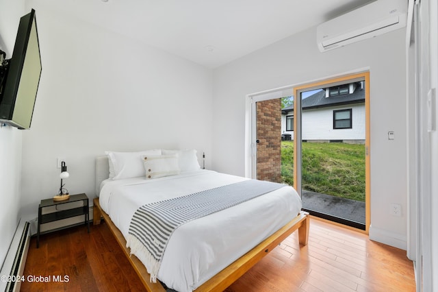 bedroom featuring dark hardwood / wood-style floors, an AC wall unit, baseboard heating, and access to outside