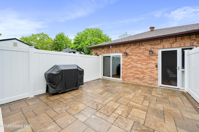 view of patio with a grill