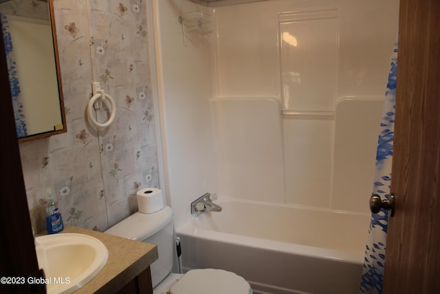 full bathroom featuring vanity,  shower combination, and toilet