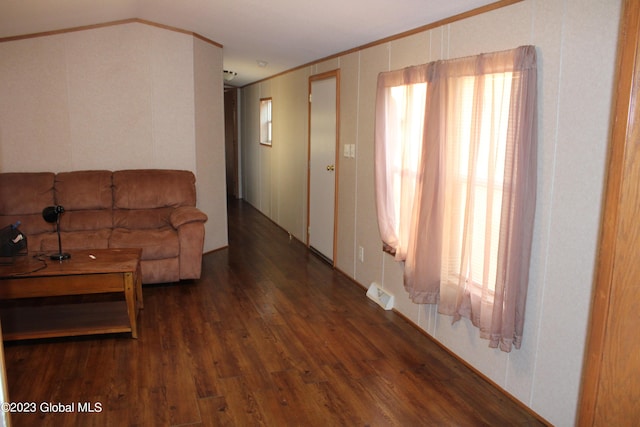 living room with crown molding and dark hardwood / wood-style floors