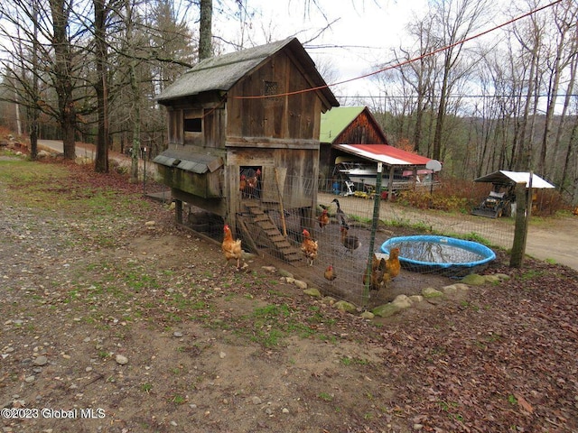 view of jungle gym with an outdoor structure