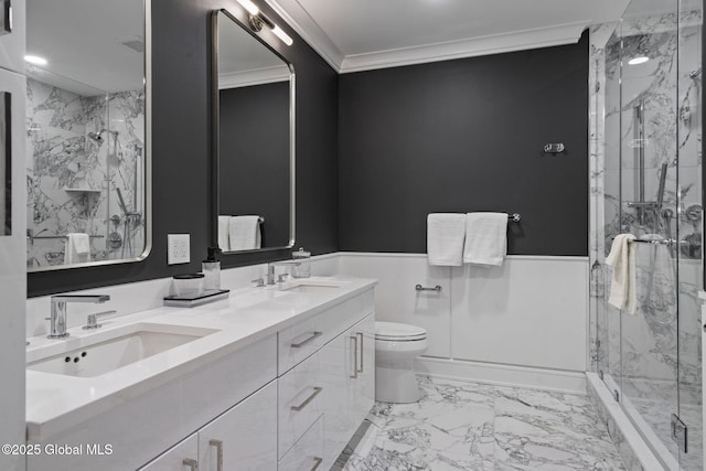 bathroom with a marble finish shower, ornamental molding, a sink, wainscoting, and marble finish floor