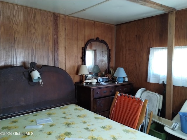 bedroom with wooden walls