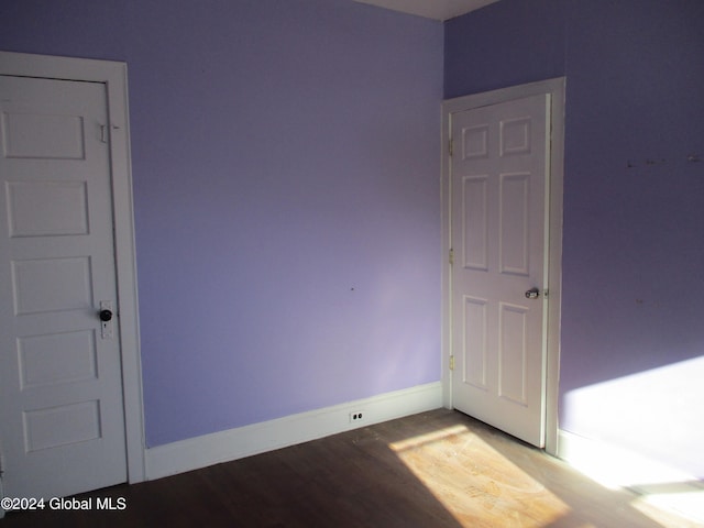 spare room featuring hardwood / wood-style flooring