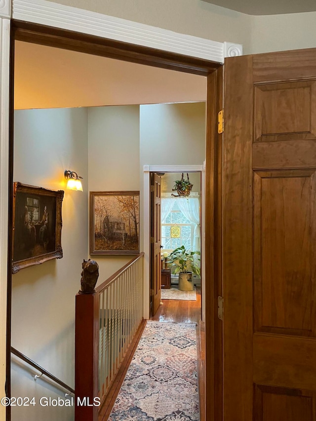 corridor featuring hardwood / wood-style floors