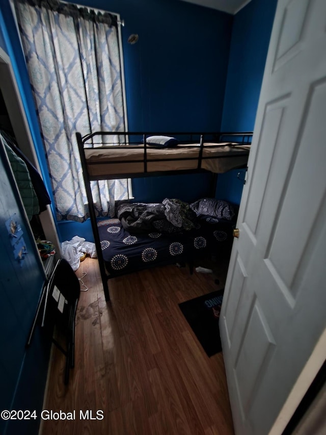 bedroom featuring dark wood-type flooring