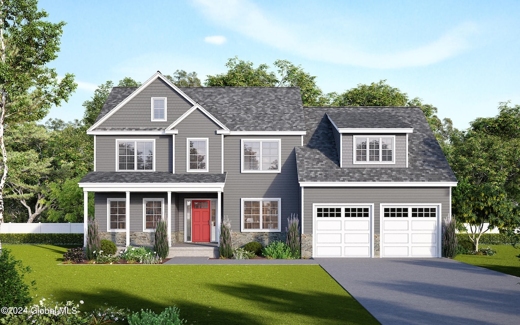 view of front of home with a front lawn and a garage