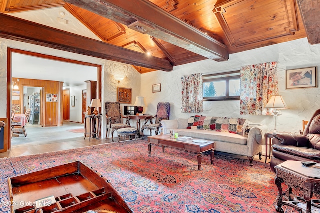 living room with tile floors, lofted ceiling with beams, and wood ceiling