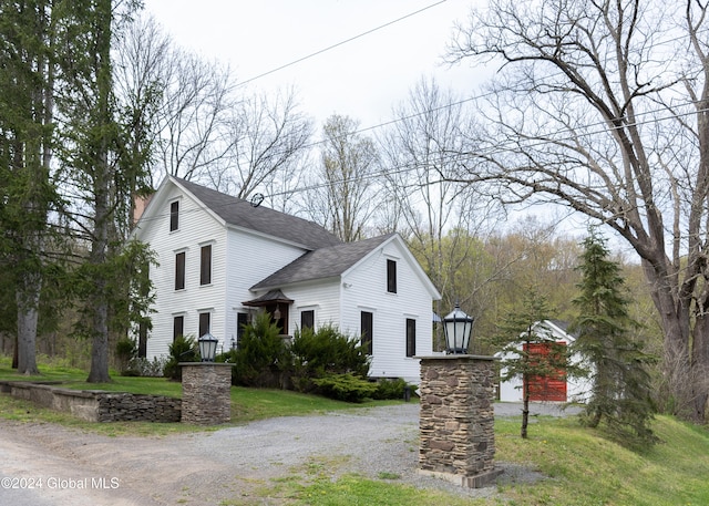 view of property exterior with a lawn