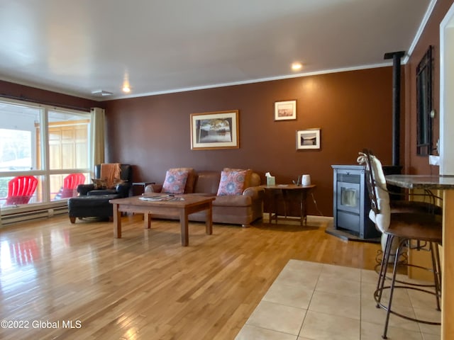 living room with a wood stove, light wood-type flooring, and crown molding