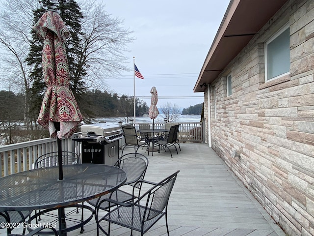 wooden terrace with area for grilling