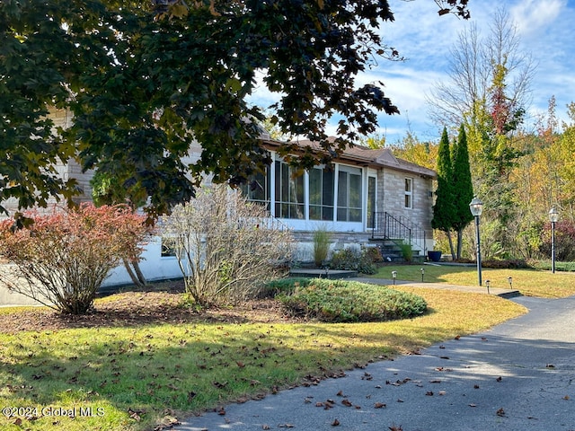 view of front of home with a front lawn