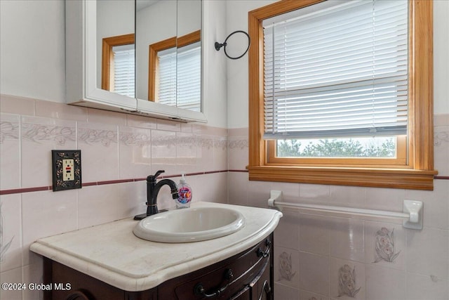 bathroom with backsplash, oversized vanity, and tile walls