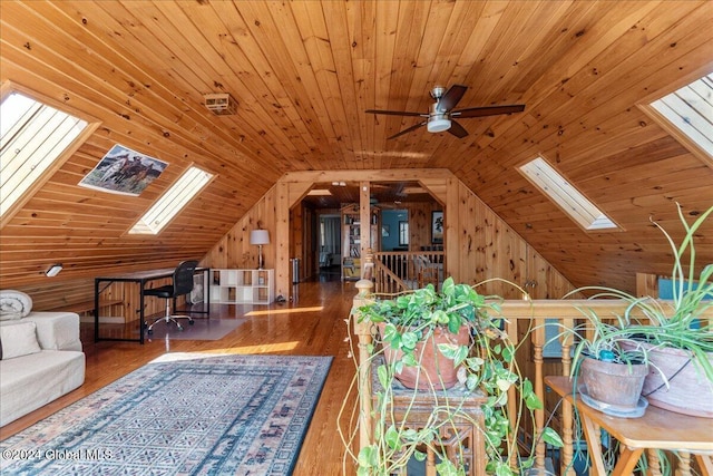 bonus room with dark hardwood / wood-style floors, vaulted ceiling with skylight, ceiling fan, and wood ceiling