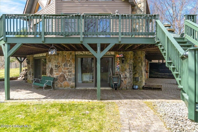 exterior space with a deck and a patio