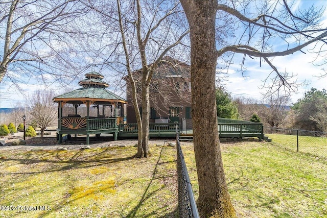 view of yard featuring a deck and a gazebo