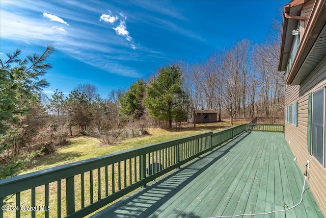 wooden terrace with a yard