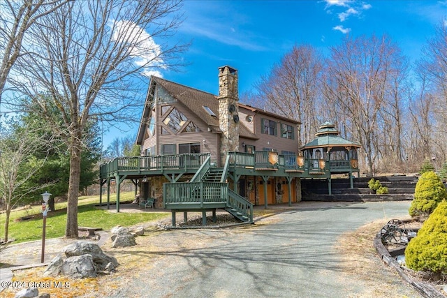 view of front of house featuring a gazebo and a deck