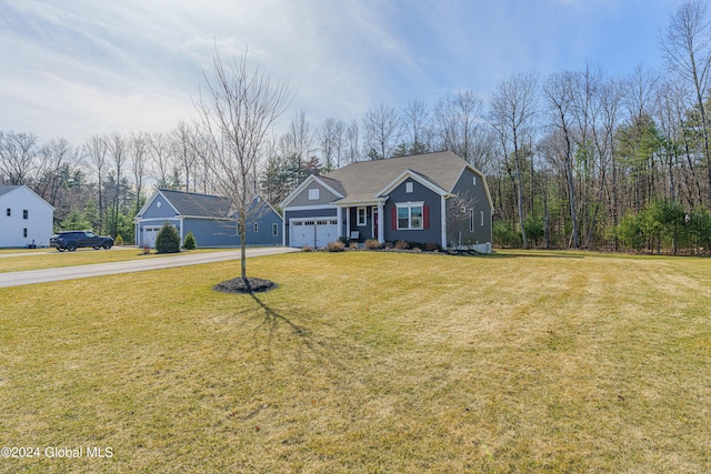 view of front of property with an attached garage, driveway, and a front yard