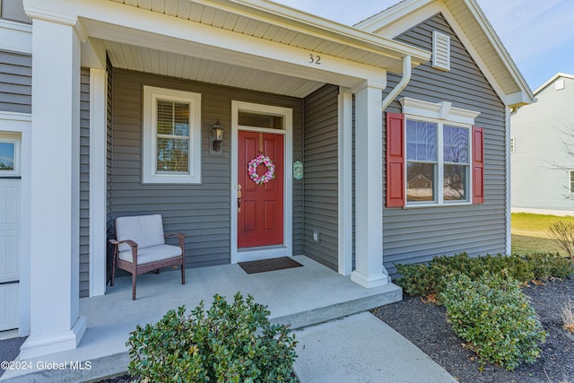 property entrance featuring a porch