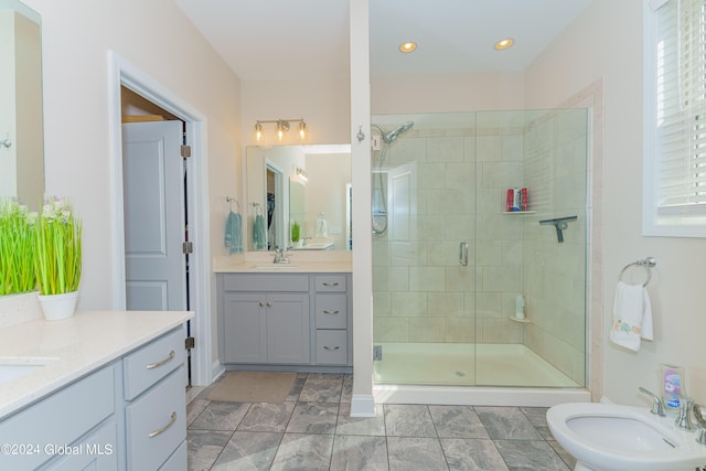 full bathroom featuring two vanities, a sink, recessed lighting, a bidet, and a shower stall