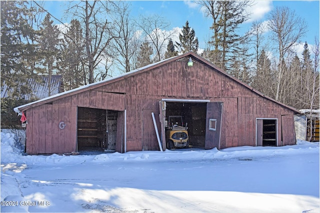 view of snow covered garage