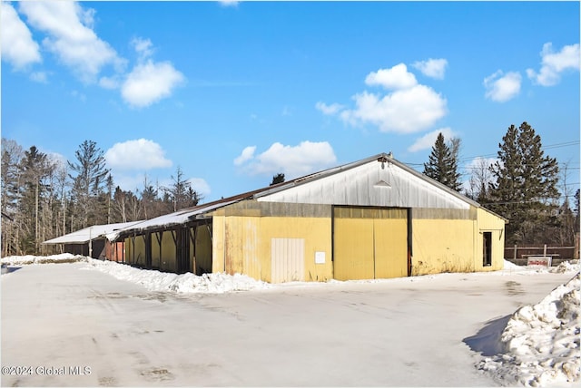 view of snow covered garage